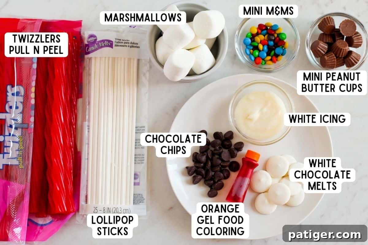 A colorful array of ingredients laid out for crafting Marshmallow Snowman Treats.