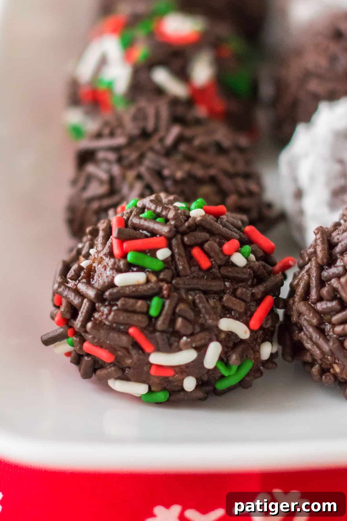 Classic rum ball with holiday sprinkles.