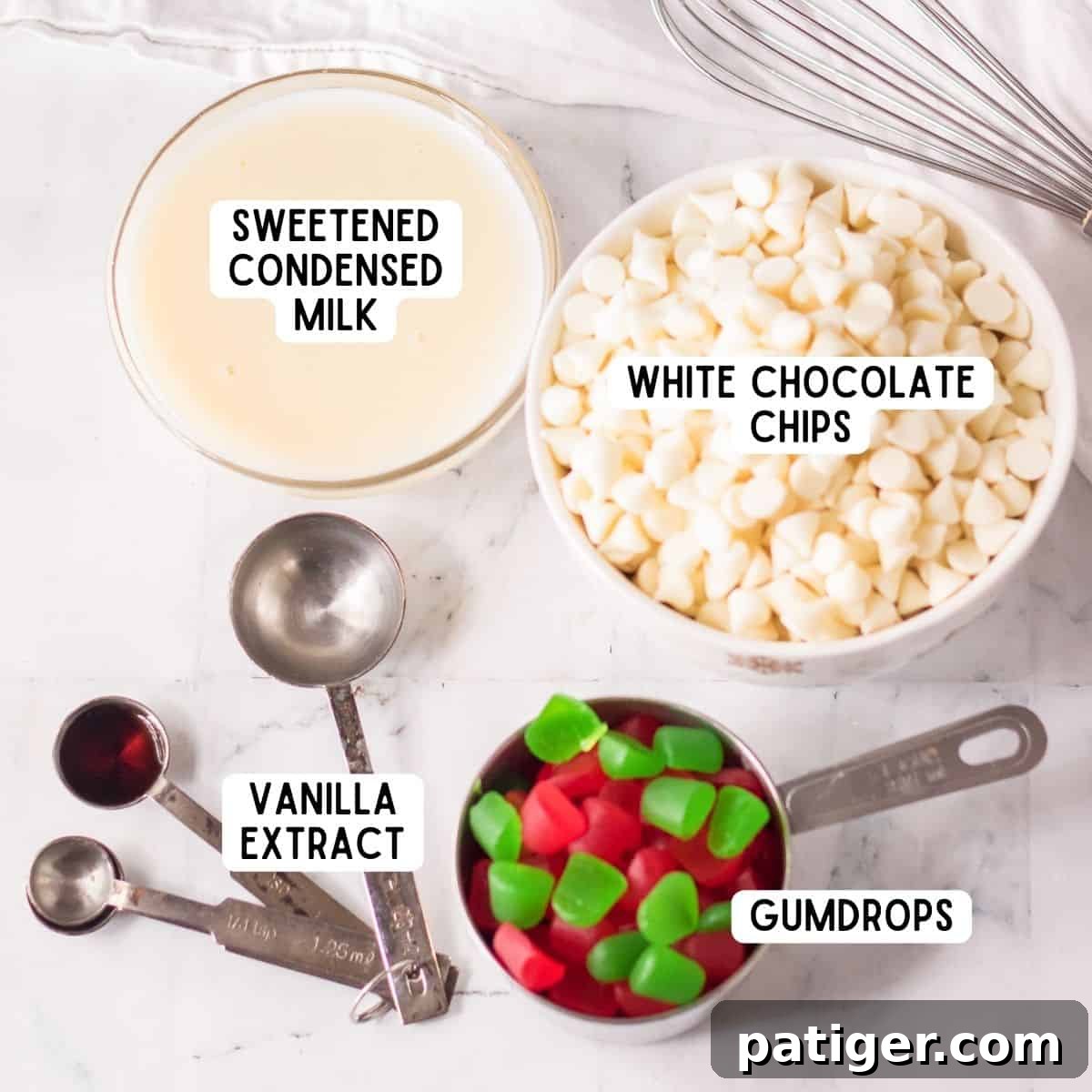 Ingredients for Christmas Gumdrop Fudge laid out on a white surface.