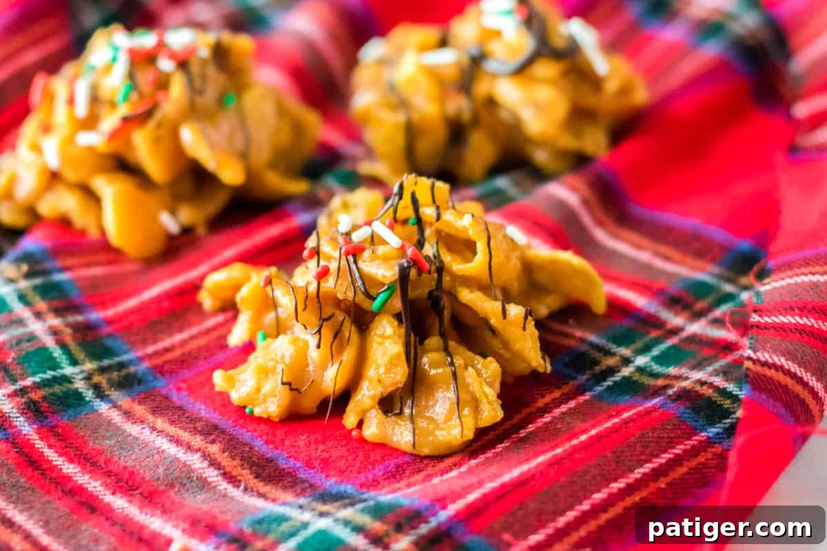 Fritos candy with chocolate drizzle and Christmas sprinkles on red plaid napkin.