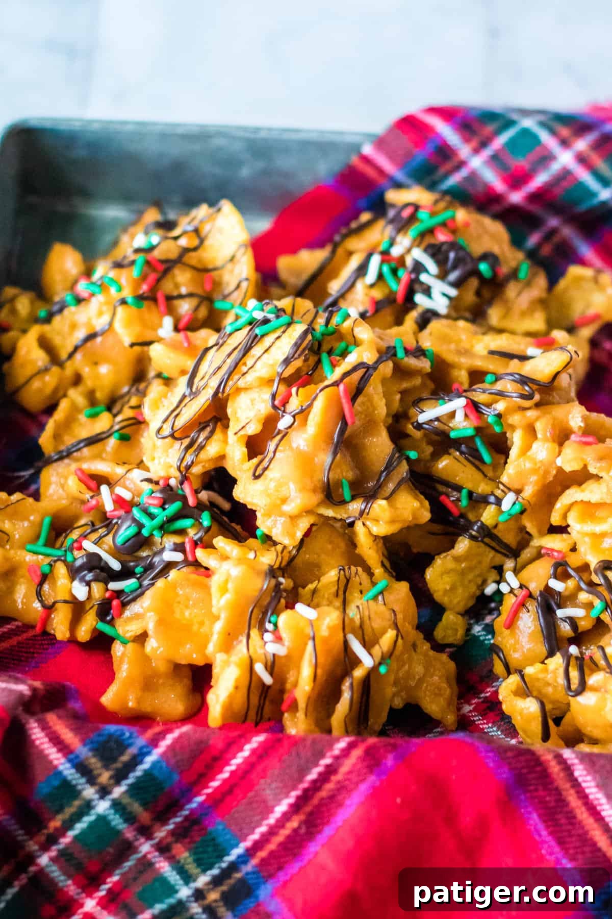 Peanut butter fritos candy in holiday napkin lined serving tray.