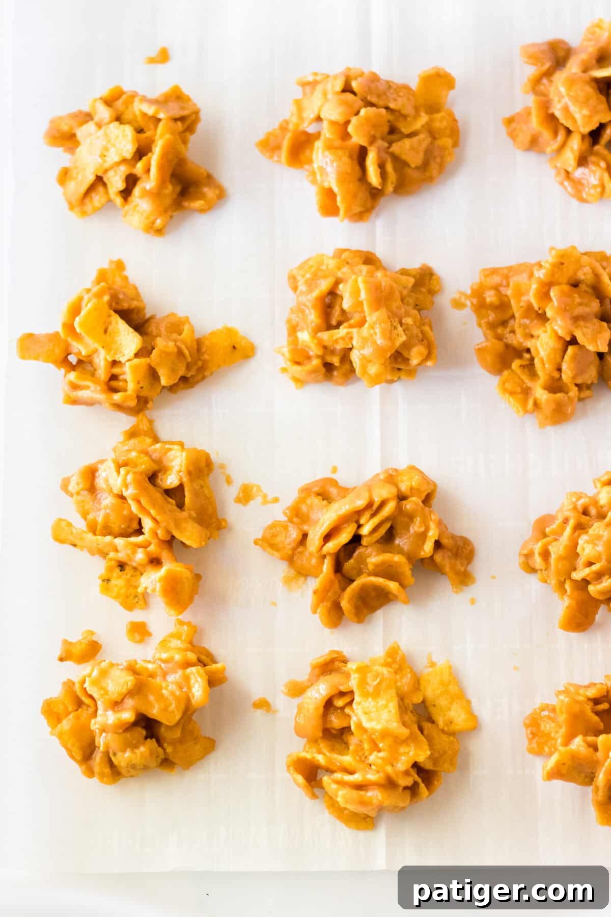 Fritos peanut butter clusters on lined tray.