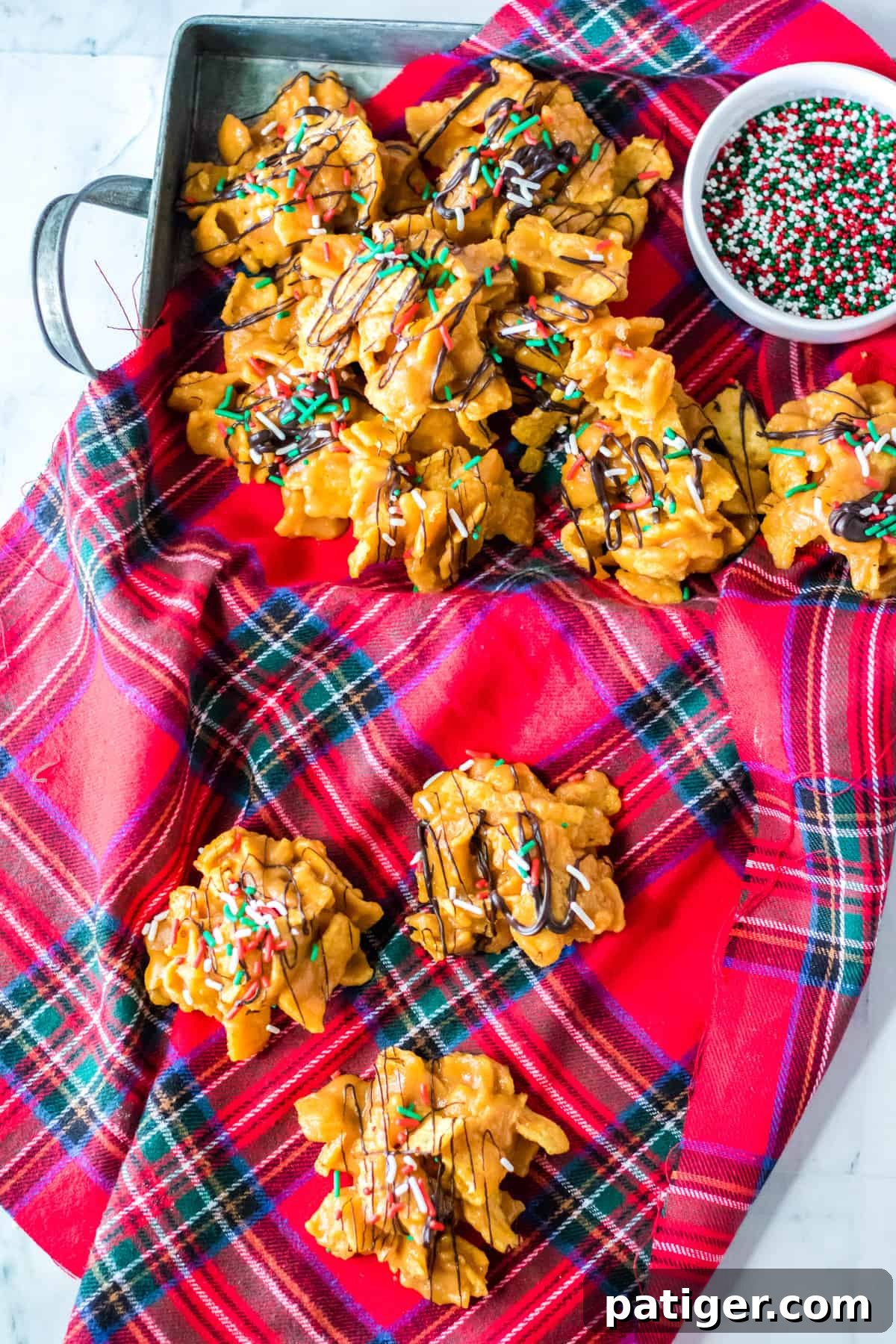 Peanut Butter fritos candies with holiday sprinkles on holiday napkin.