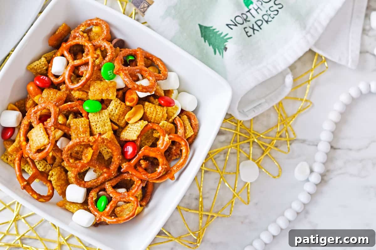 Holiday Hearth Mix 6 Chex mix with red and green M&M candies in small white bowl.