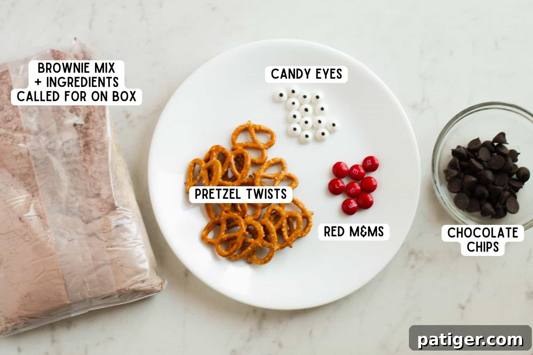 A flat lay photograph showcasing all the ingredients required for easy reindeer brownies, neatly arranged on a kitchen countertop.