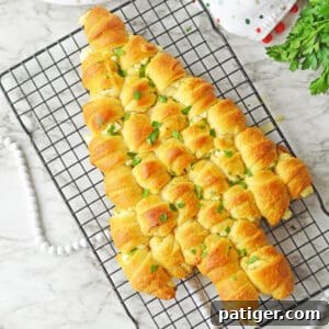 Crescent rolls baked in the shape of a Christmas tree, golden and inviting.
