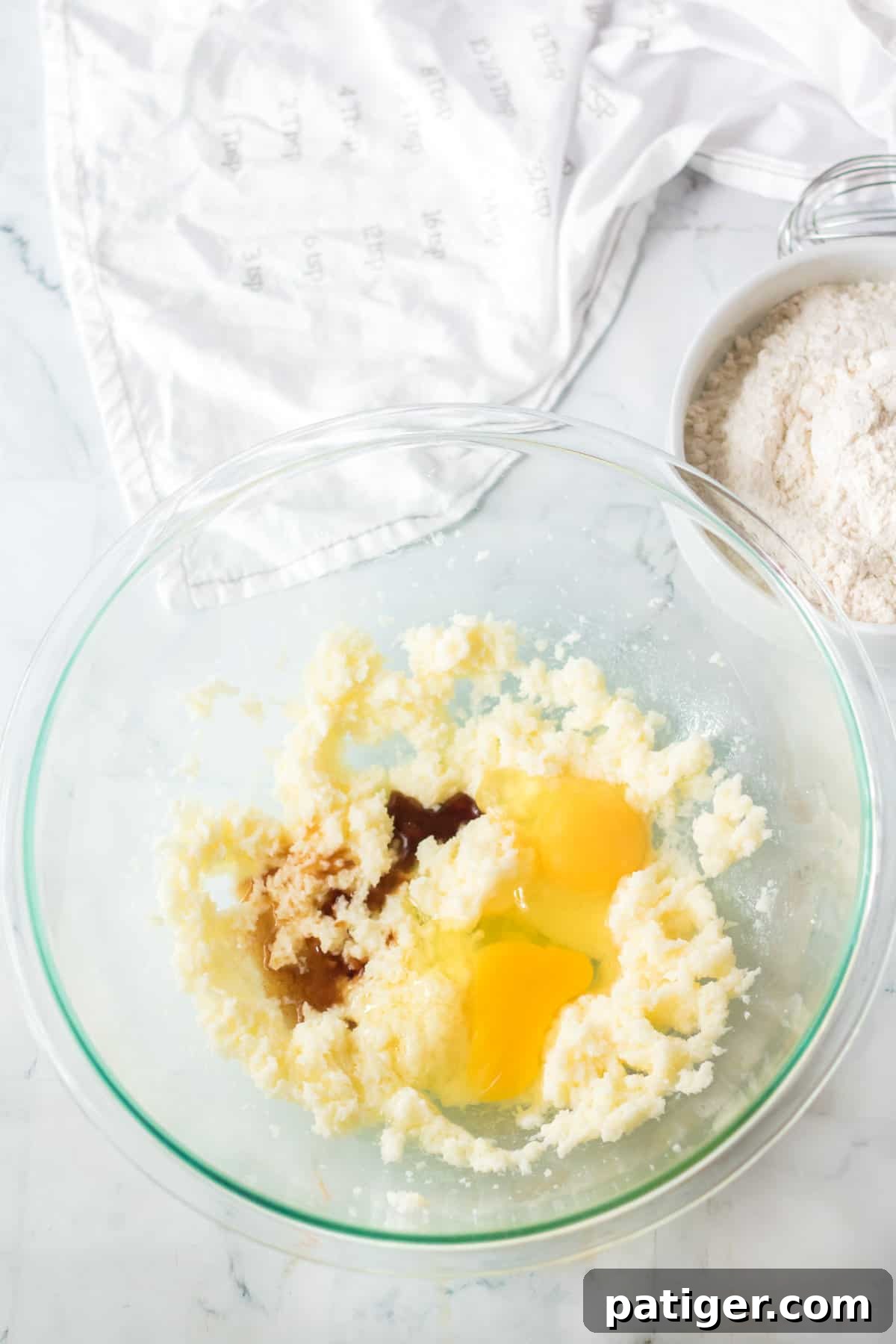 Eggs and vanilla added to mixing bowl.