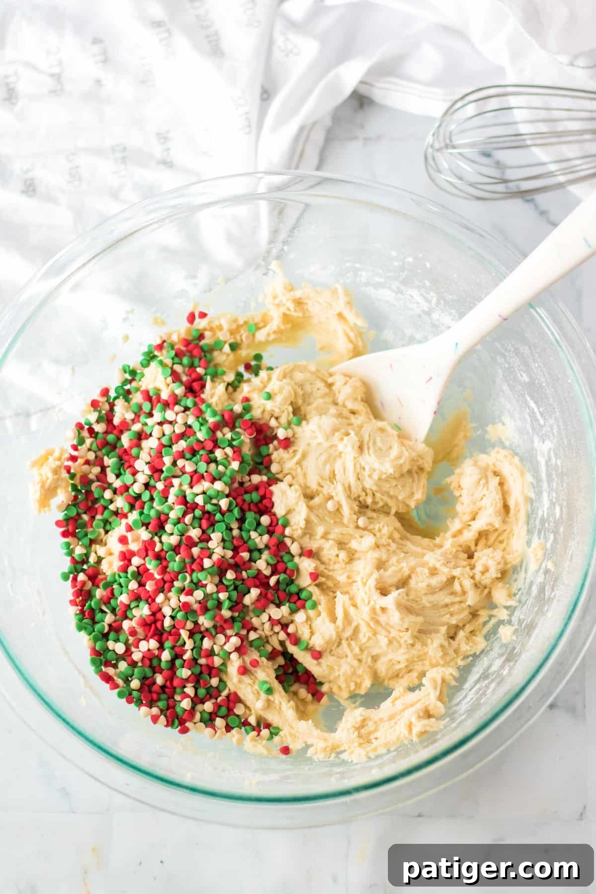 Holiday baking chips added to bowl.