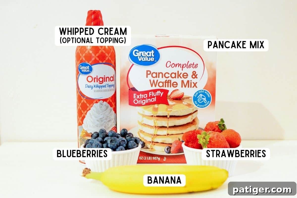 Ingredients for bunny pancakes: complete pancake mix, strawberries, blueberries, banana, and optional whipped cream for decorating.