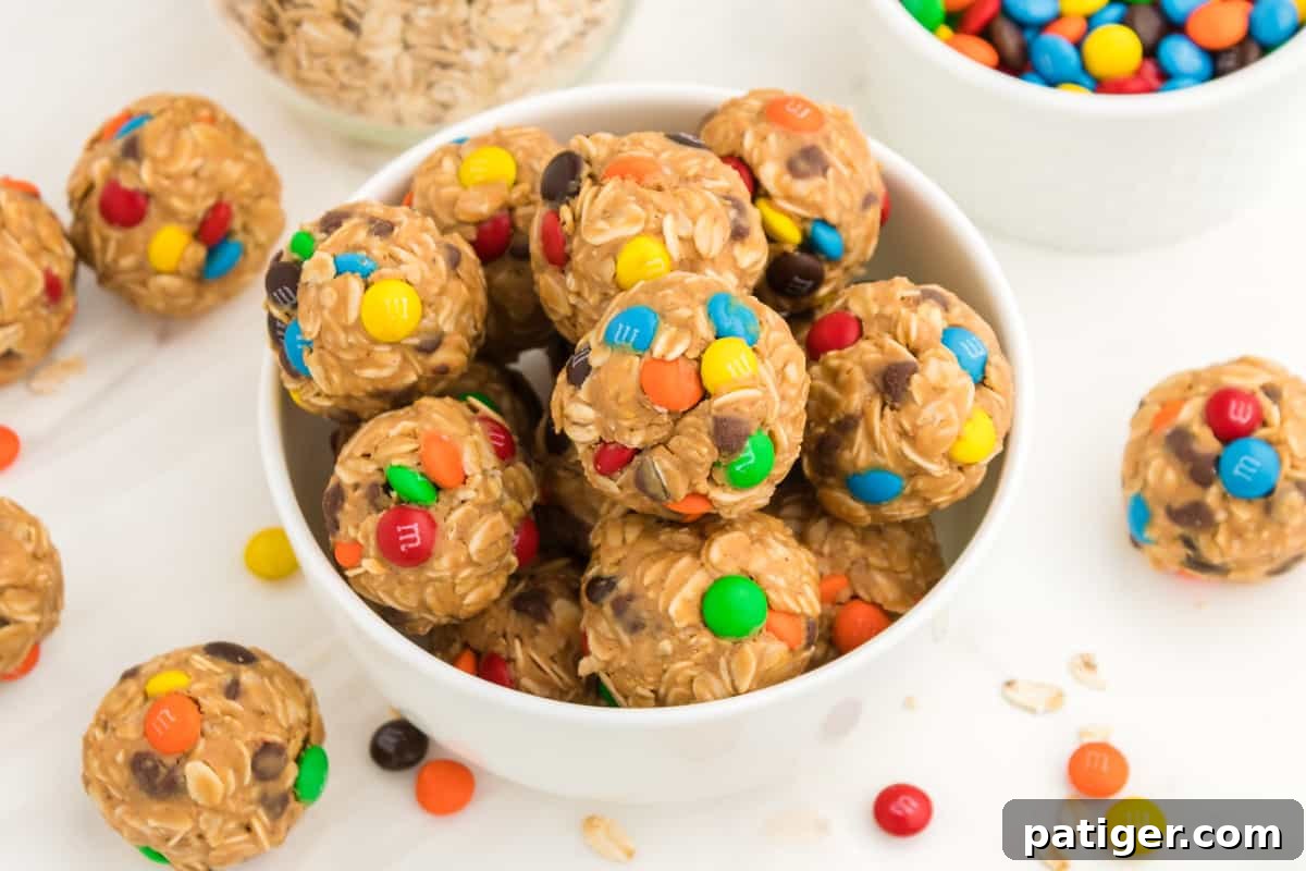 No-Bake Monster Cookie Energy Bites 10 Bowl of oatmeal balls with chocolate chips and M&Ms.