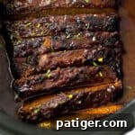 Slow cooker brisket with bbq sauce and seasonings.