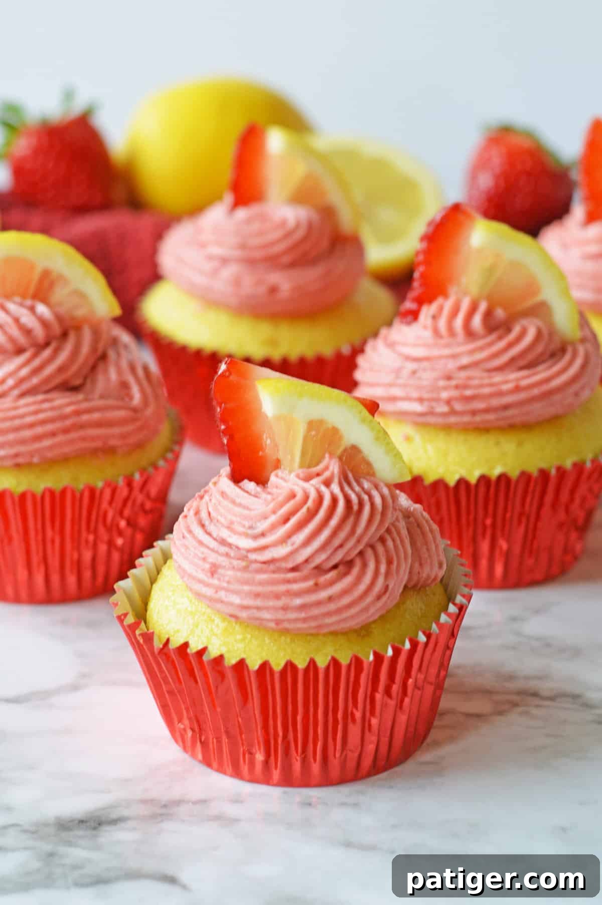 Pink Lemonade Swirl Cupcakes 7 Strawberry lemonade cupcakes made from cake mix, featuring homemade strawberry lemon frosting, and beautifully finished with fresh lemon and strawberry slices.
