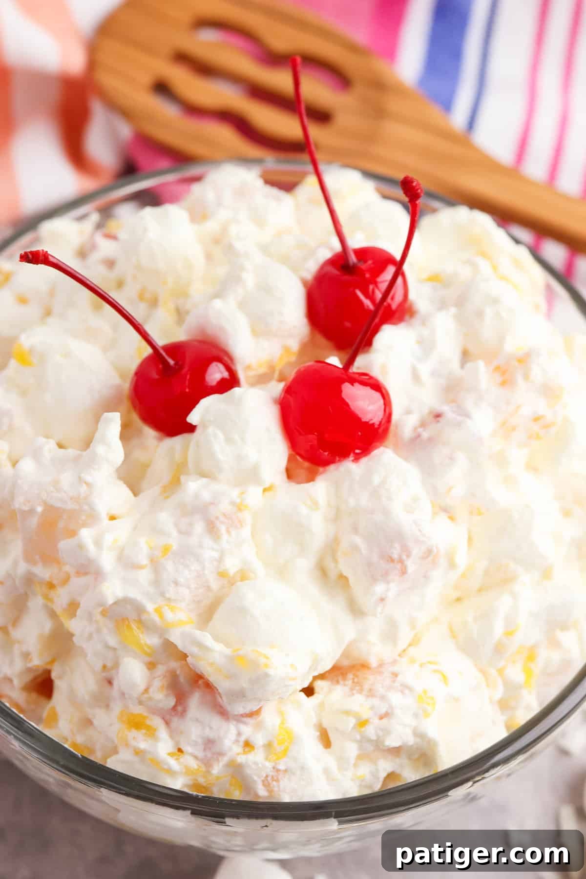 Cloud Nine Fruit Salad 8 Marshmallow Fruit Salad beautifully garnished with three maraschino cherries on top.