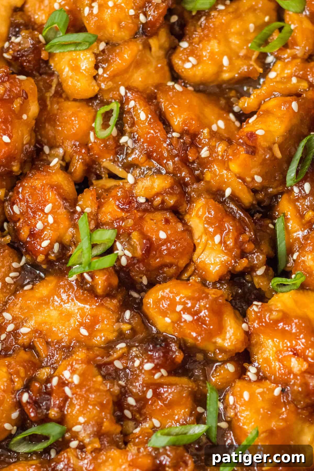 Bite-size pieces of take-out style orange chicken.