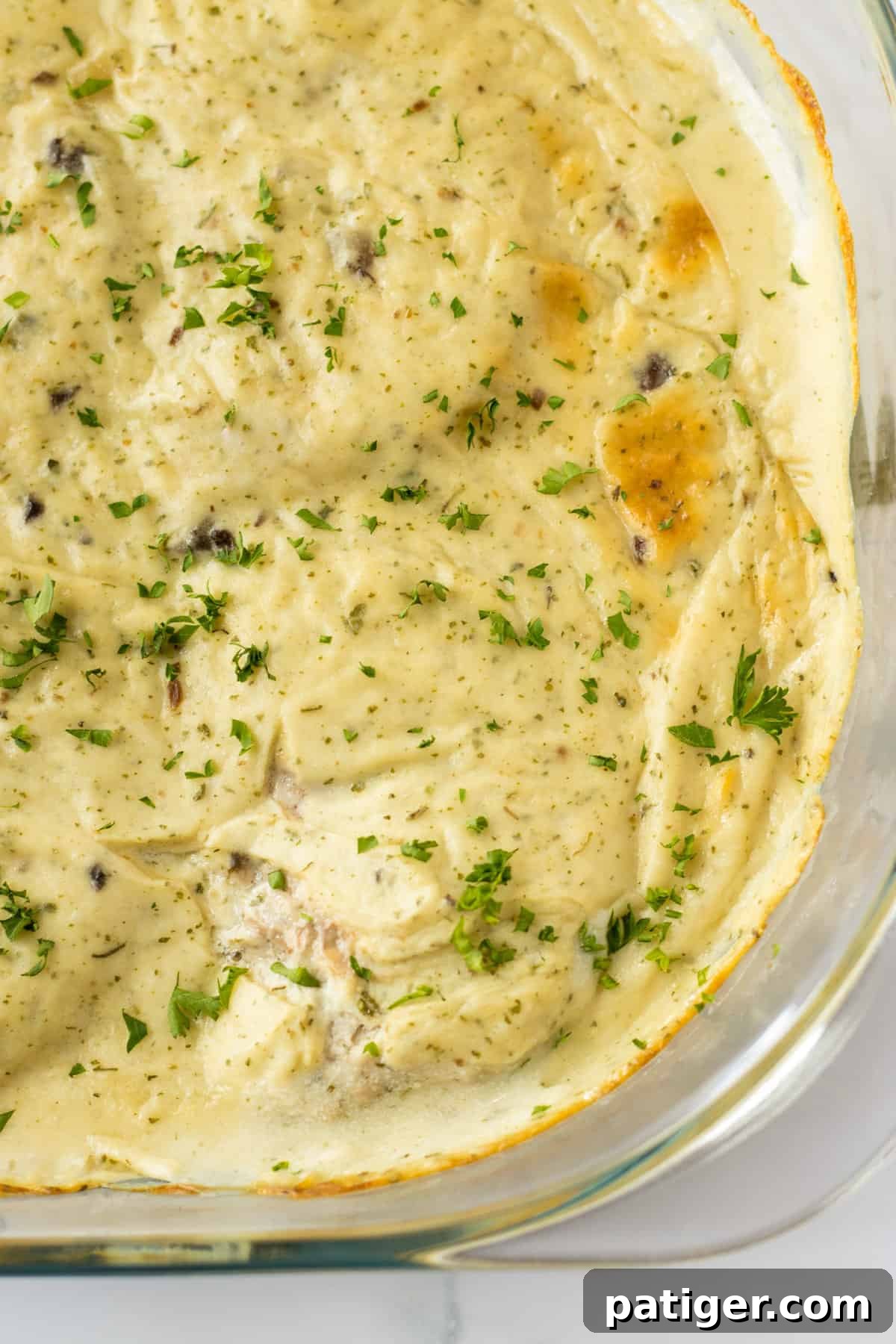 Effortless 4-Ingredient Oven Baked Pork Chops 6 Oven baked cream of mushroom pork chops in glass baking pan.