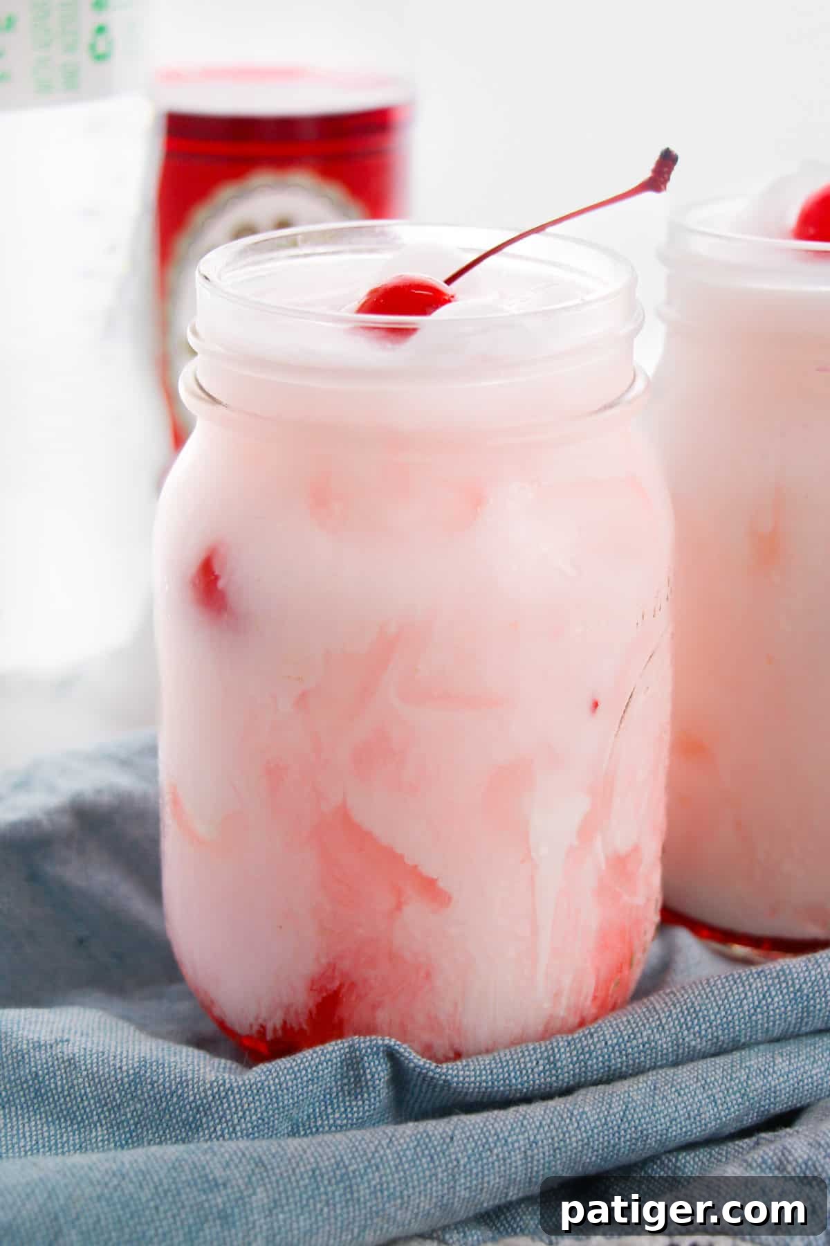 Shirley Temple Cream Soda 2 Shirley temple dirty soda with Sprite, grenadine, creamer, and maraschino cherry.
