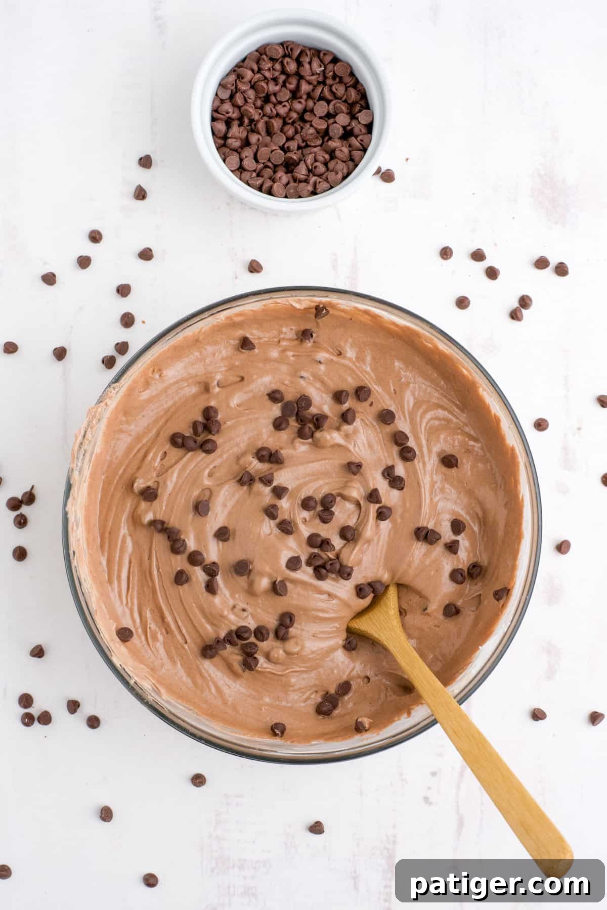 Edible Brownie Batter Dream 8 Chocolate chips folded in to mixture with wooded spoon.