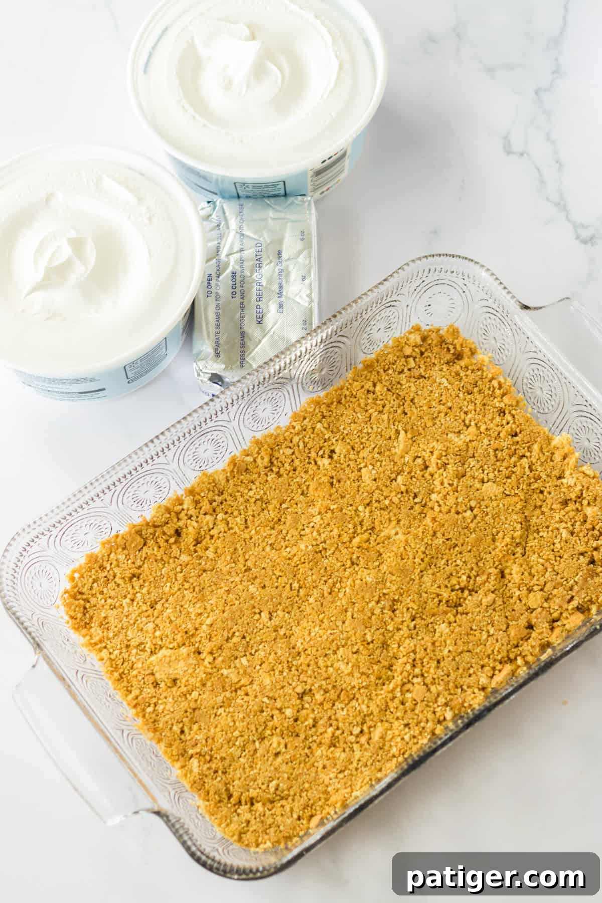 Graham cracker crust pressed in 9 x 13 glass baking dish.