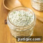 Delicious Homemade Ranch Seasoning 8 Homemade ranch seasoning mix with buttermilk powder in a small glass jar, perfect for sharing.