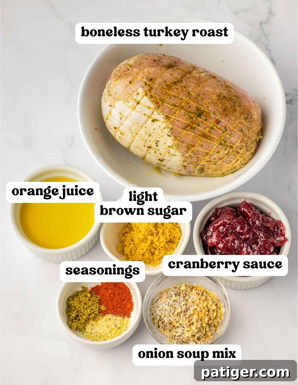 Tender Slow Cooker Boneless Turkey Breast 3 Boneless turkey roast, orange juice, canned cranberry sauce, light brown sugar, and a selection of seasonings laid out for the recipe preparation.