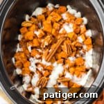 Crockpot sweet potato casserole with marshmallows and pecans, a delightful holiday dish.