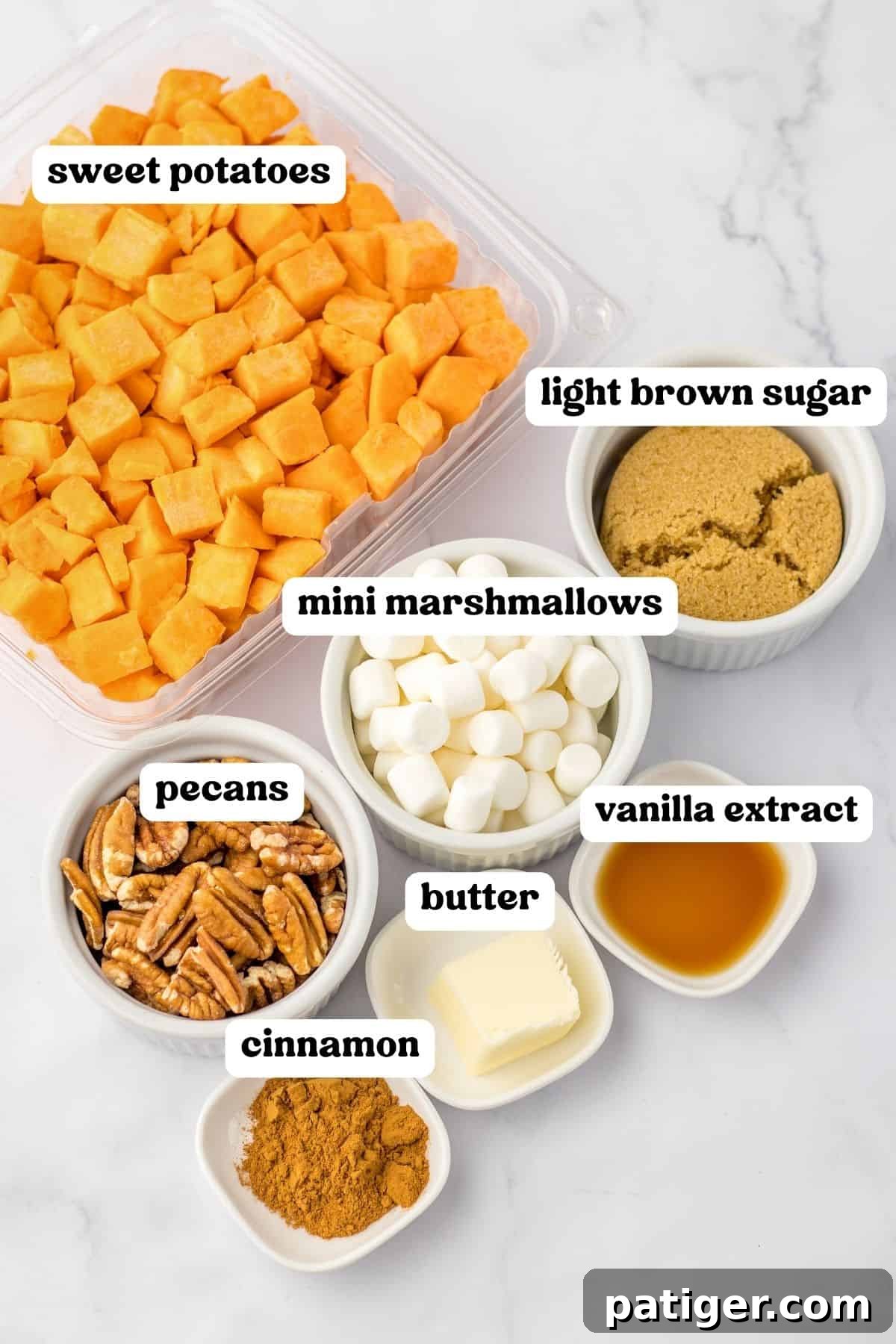 Slow Cooker Sweet Potato Bliss 4 Ingredients on countertop: diced sweet potatoes, light brown sugar, vanilla extract, mini marshmallows, pecans, butter and cinnamon, laid out for easy viewing.