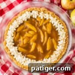 No bake apple pie with whipped cream piped around the perimeter.