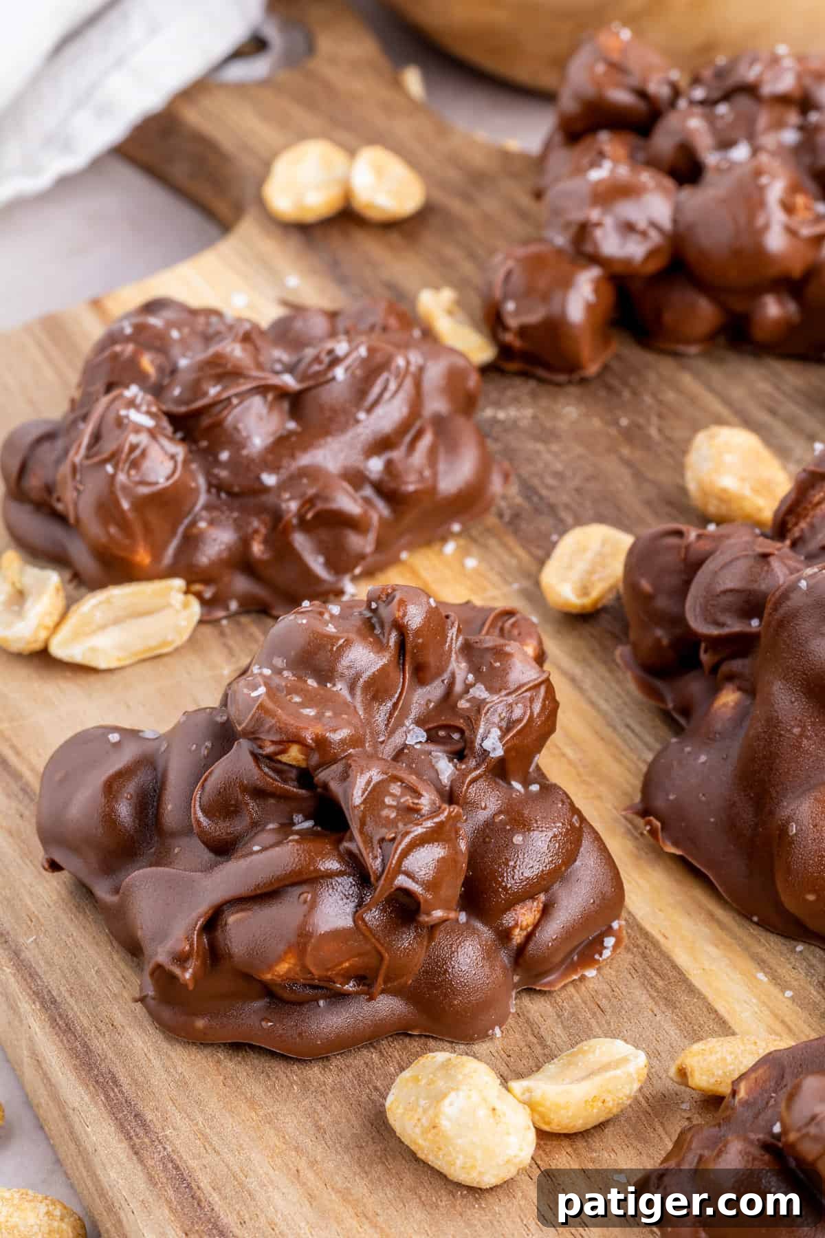 Rocky road on wooden board with peanuts.