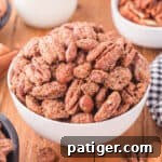 Candied pecans and almonds in a white bowl, close-up.