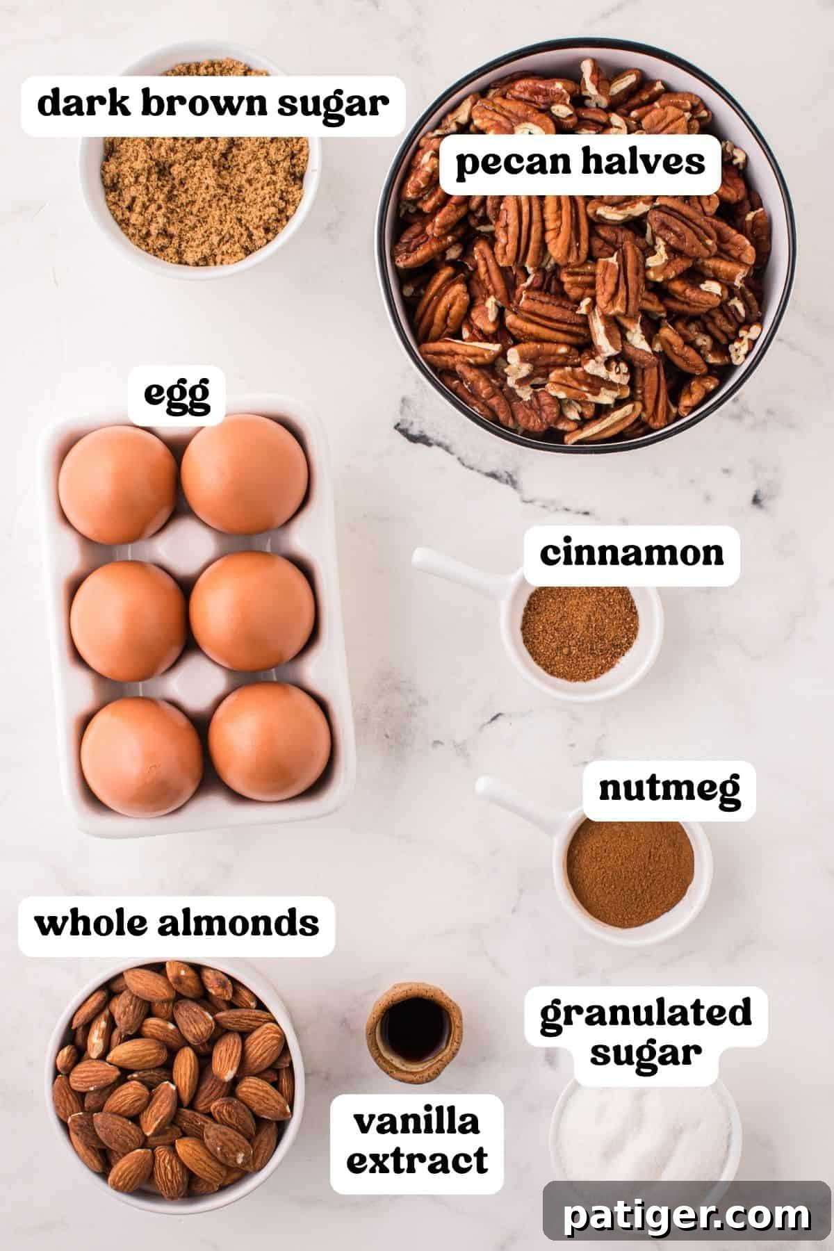 Collection of ingredients for candied nuts: dark brown sugar, whole almonds, pecan halves, egg, cinnamon, nutmeg, vanilla extract and granulated sugar.