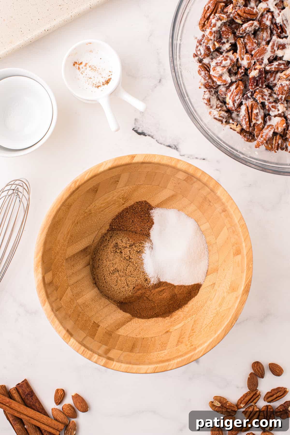 Small bowl containing a mixed blend of dark brown sugar, white sugar, cinnamon, and nutmeg.