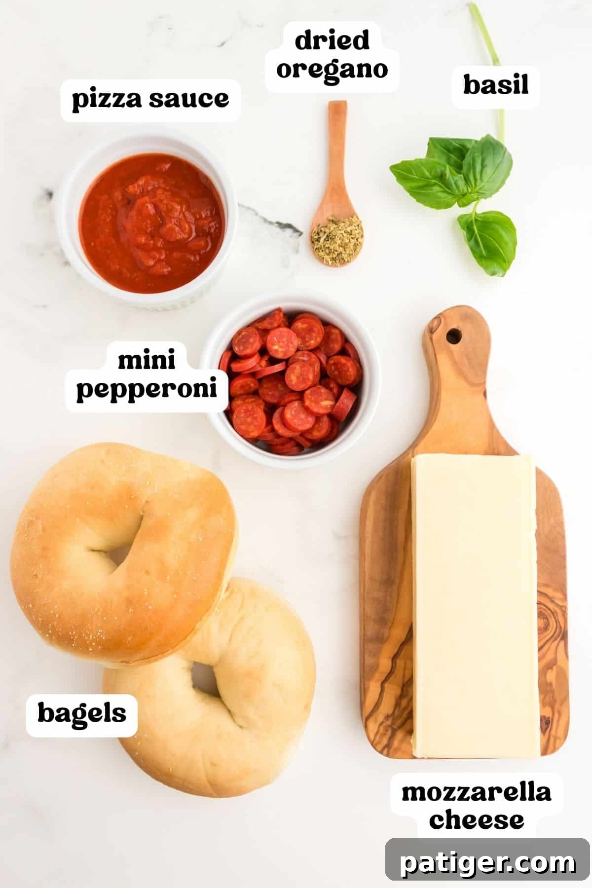 Pizza sauce, dried oregano, fresh basil, plain bagels, mozzarella cheese, and mini pepperoni.