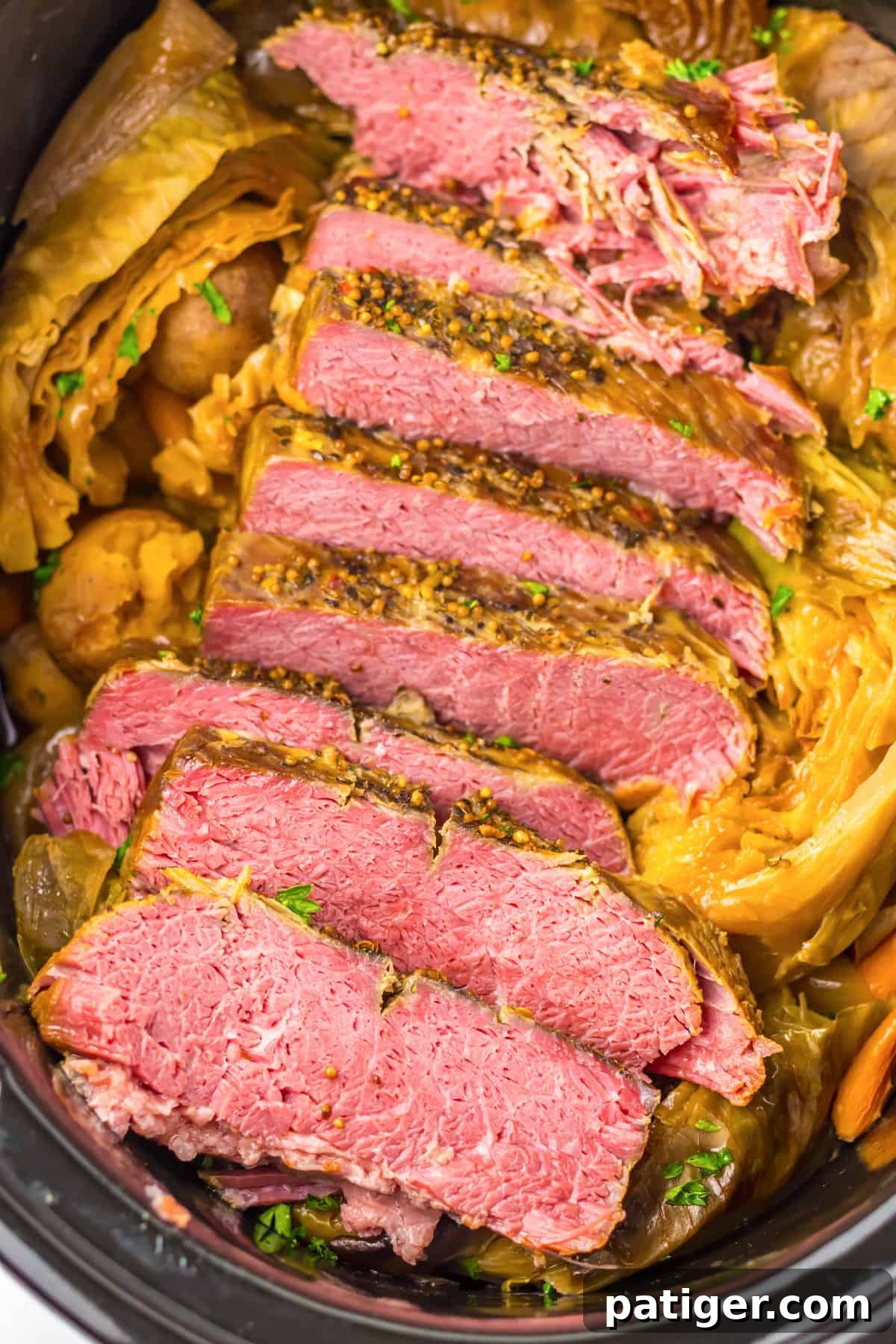 Melt-in-Your-Mouth Slow Cooker Corned Beef 2 A hearty slow cooker corned beef brisket and cabbage meal, ready to be served from the crockpot.