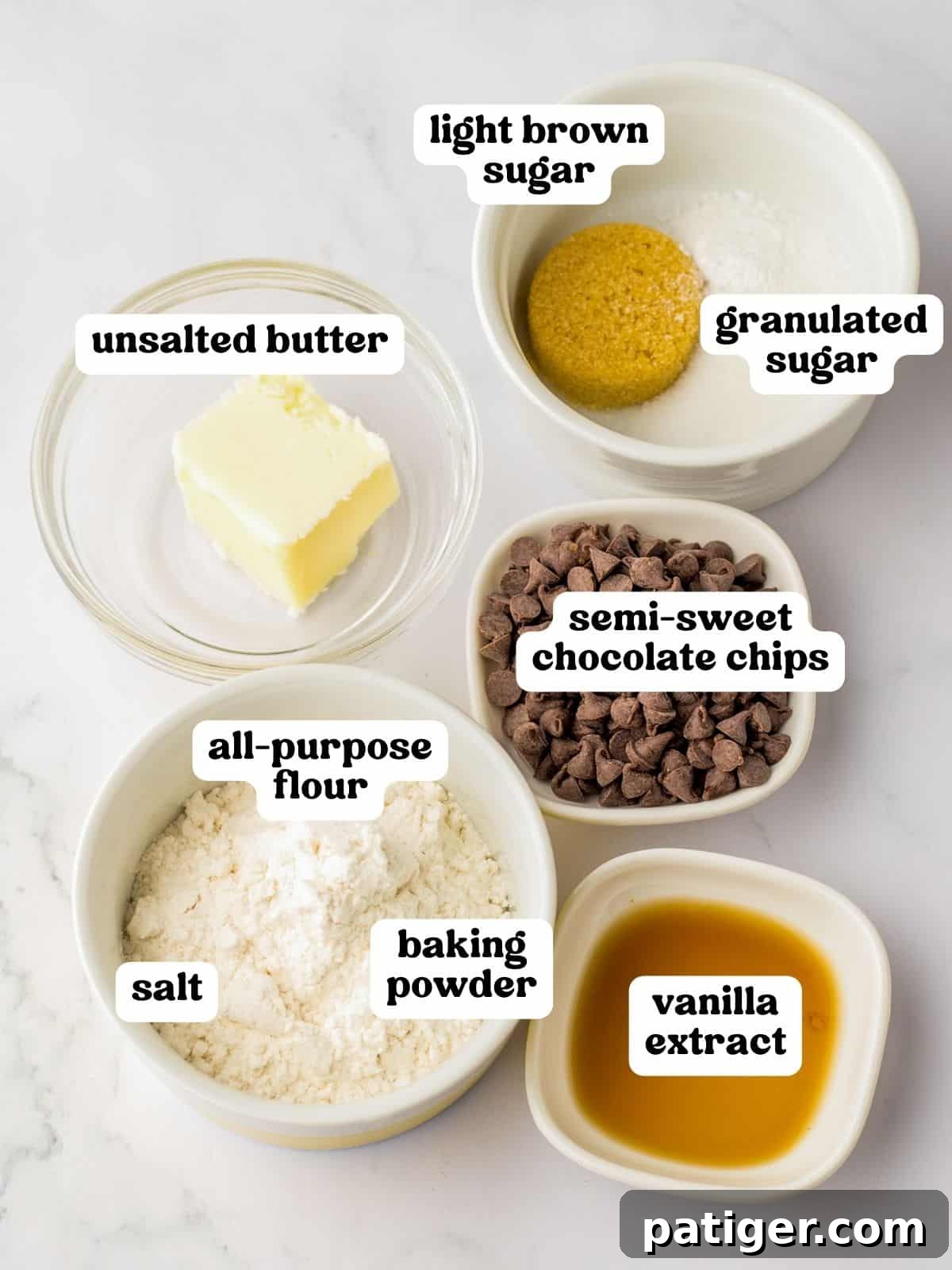 Microwave cookie ingredients: unsalted butter, all-purpose flour, light brown sugar, chocolate chips, vanilla extract, baking powder, salt.