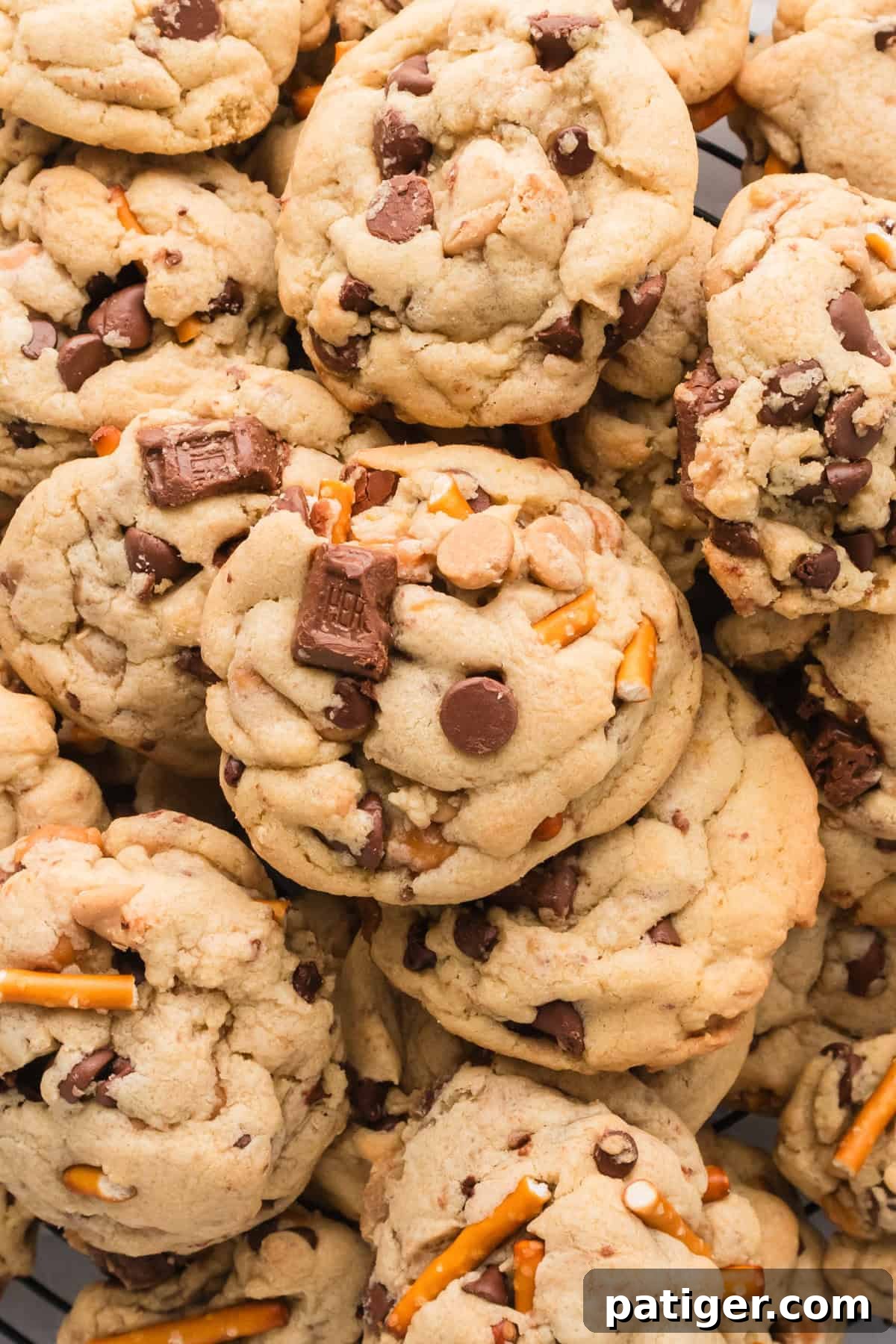 Mega Mix Cookies 2 Thick Kitchen Sink Cookies with chocolate chips, peanut butter chips, pretzels, toffee bits, caramel bits, and chocolate chunks.