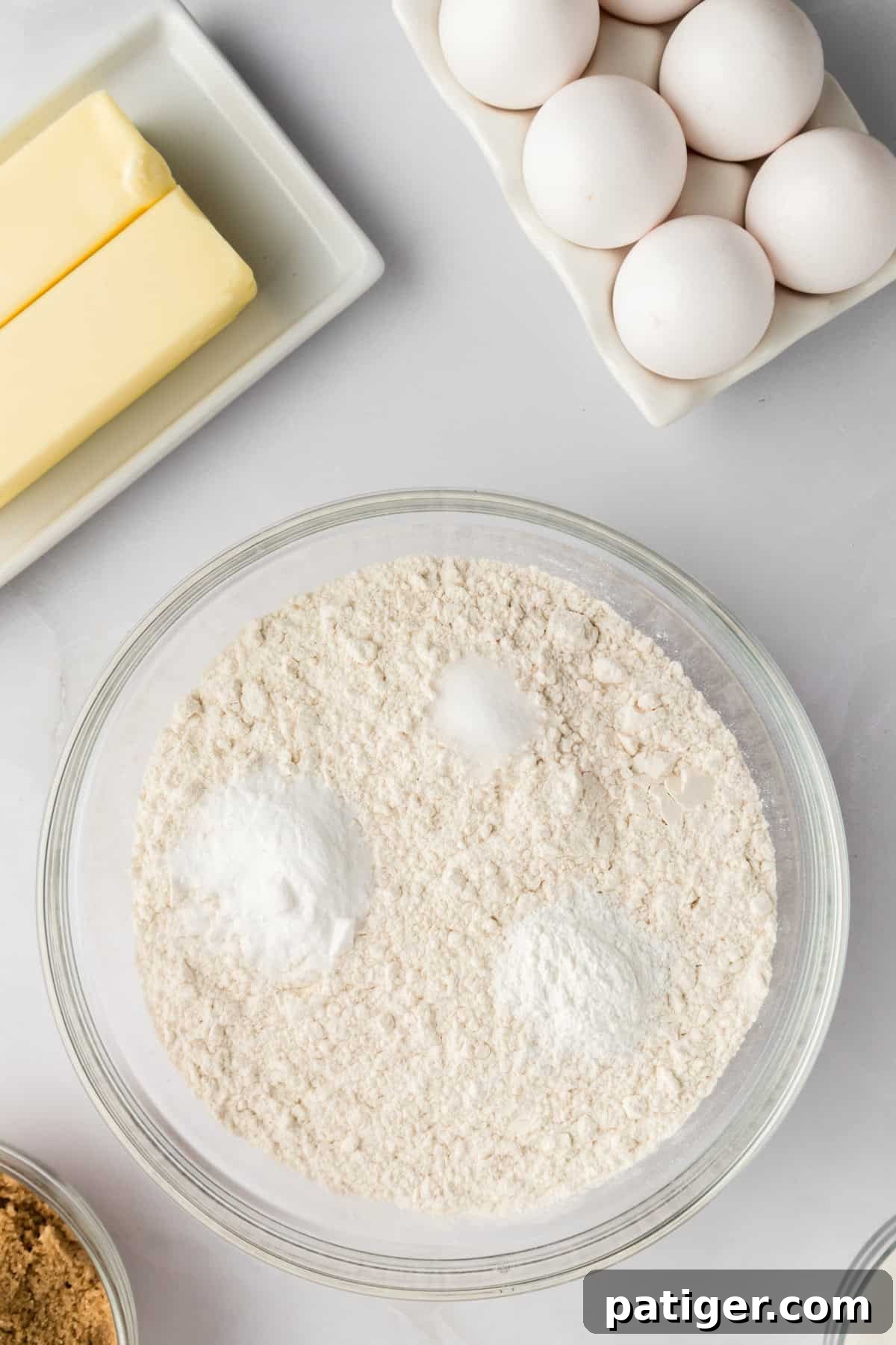 Mega Mix Cookies 6 Dry ingredients in a glass mixing bowl.