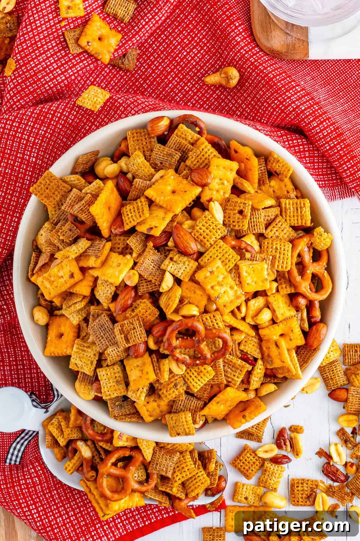 Blazin' Snack Fusion 9 Overhead photo of the bowl of spicy firecracker chex mix with some of the snack mix scattered on the table around it.