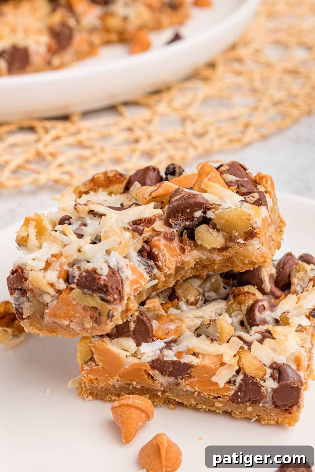 Seven layer bar cookie with bite taken out of it.