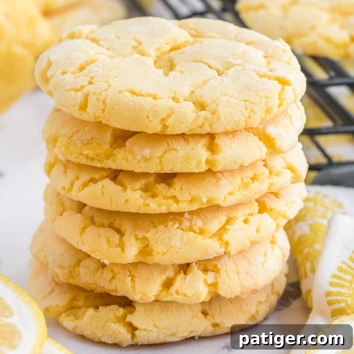 Bright and zesty lemon cake mix cookies made from just 3 ingredients, arranged on a white serving platter.