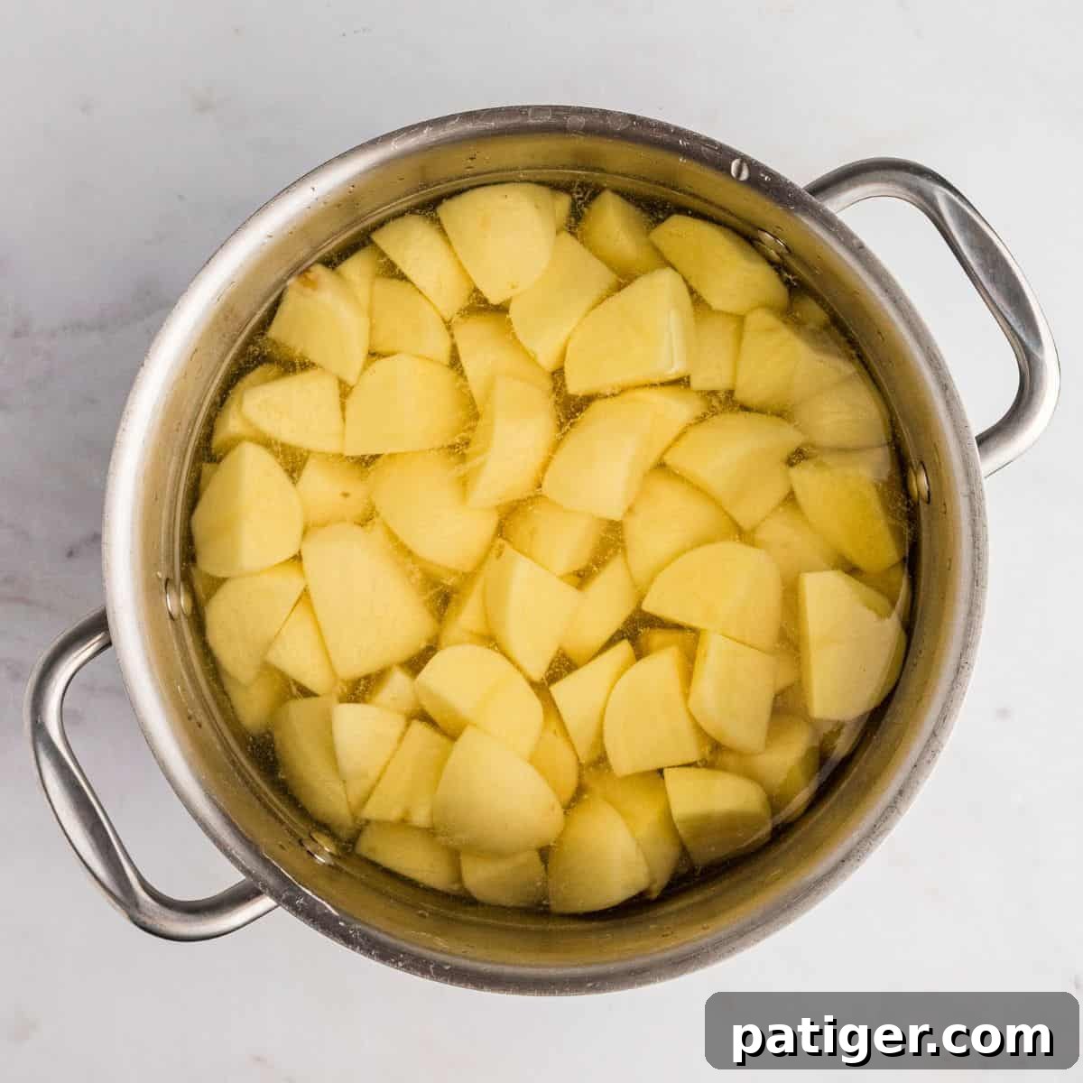 Spud-tacular Party Bites 5 Peeled and cubed potatoes in large pot of water.