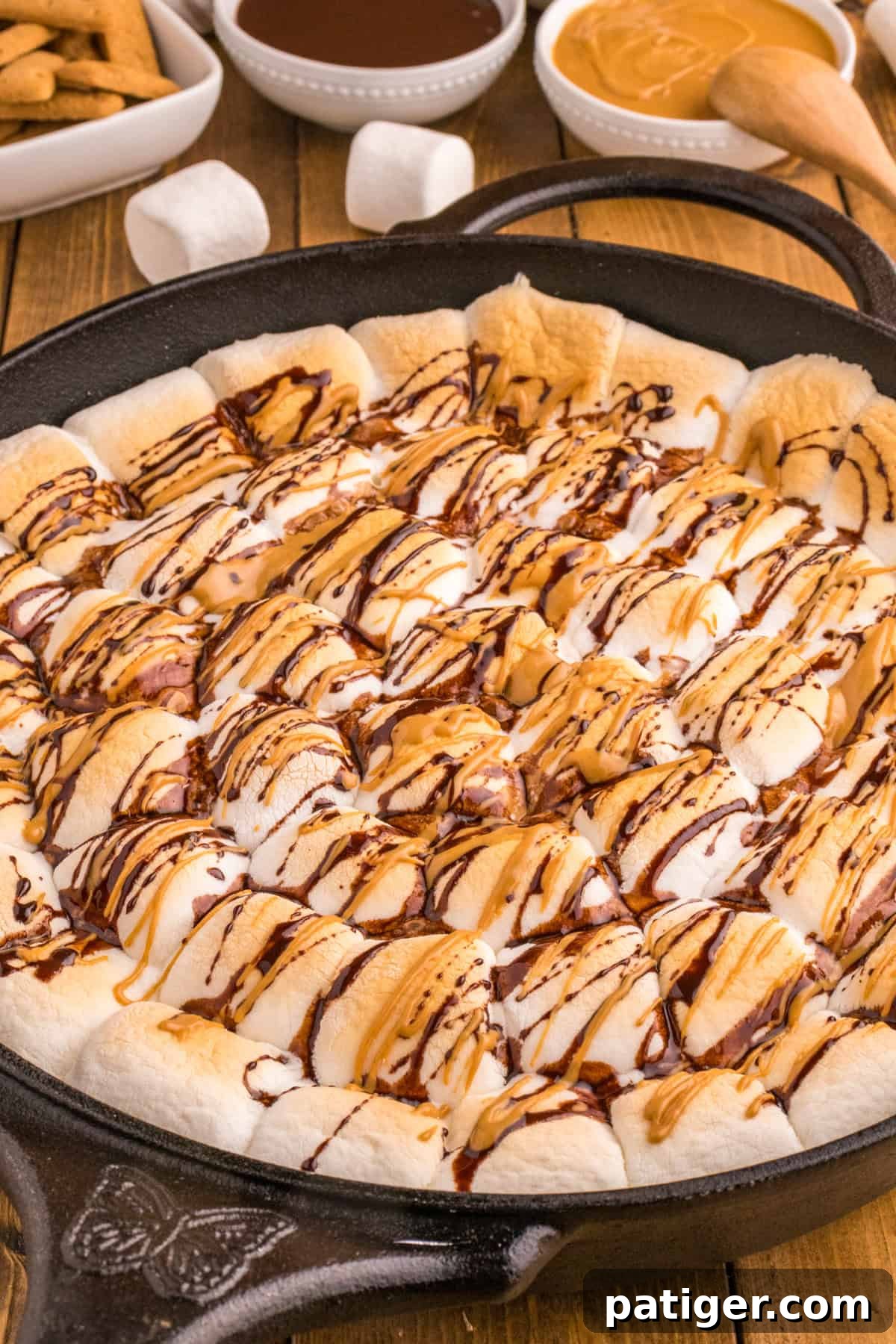 Skillet S'mores made with Reese's peanut butter cups, Hershey chocolate, and marshmallows.