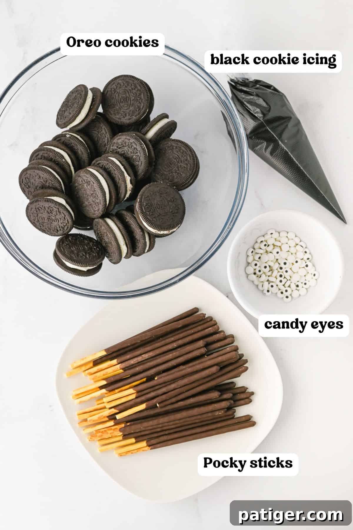 Oreo cookies, black cookie icing, pocky candy, candy eyes.