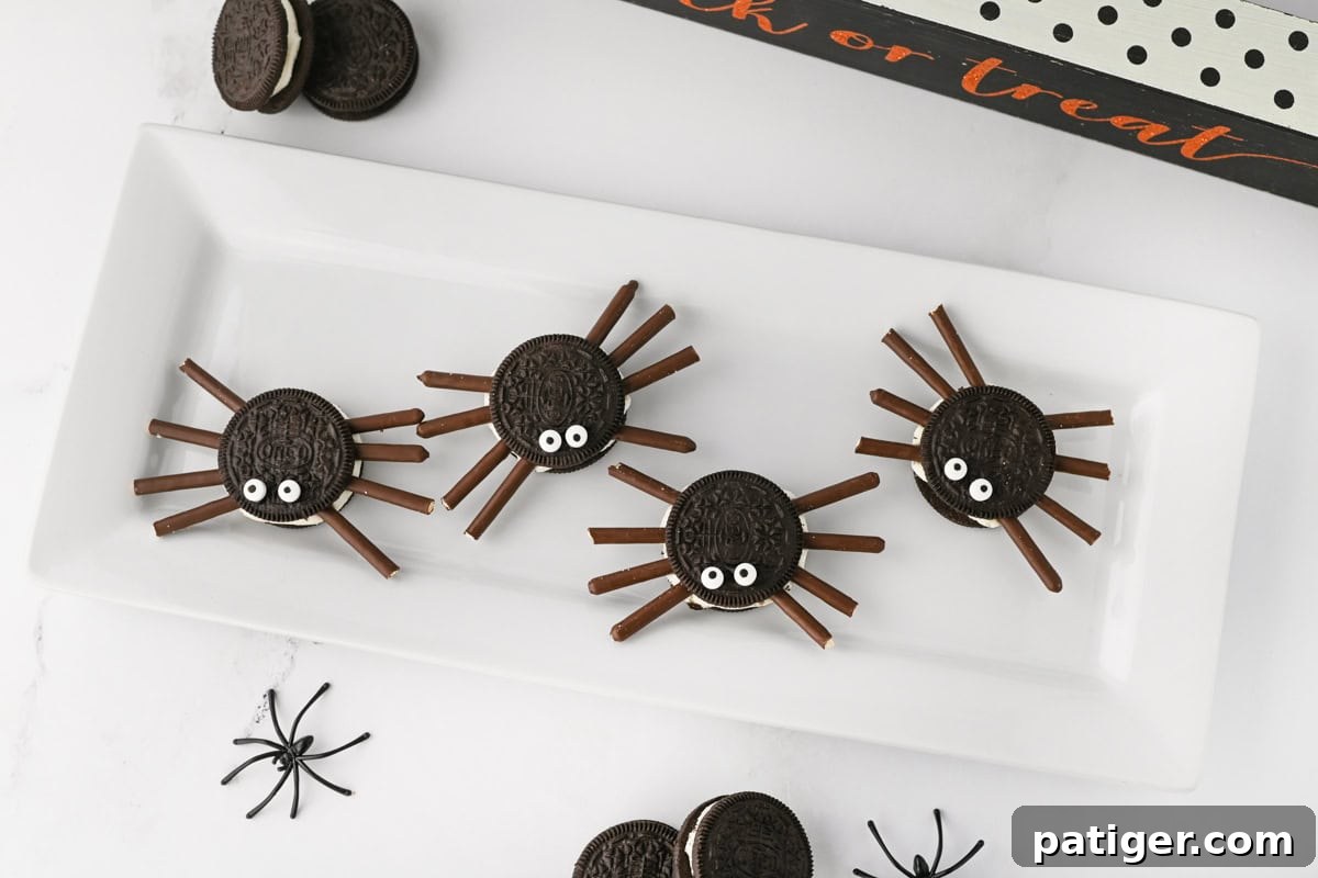 Oreo spiders for Halloween on a white platter.