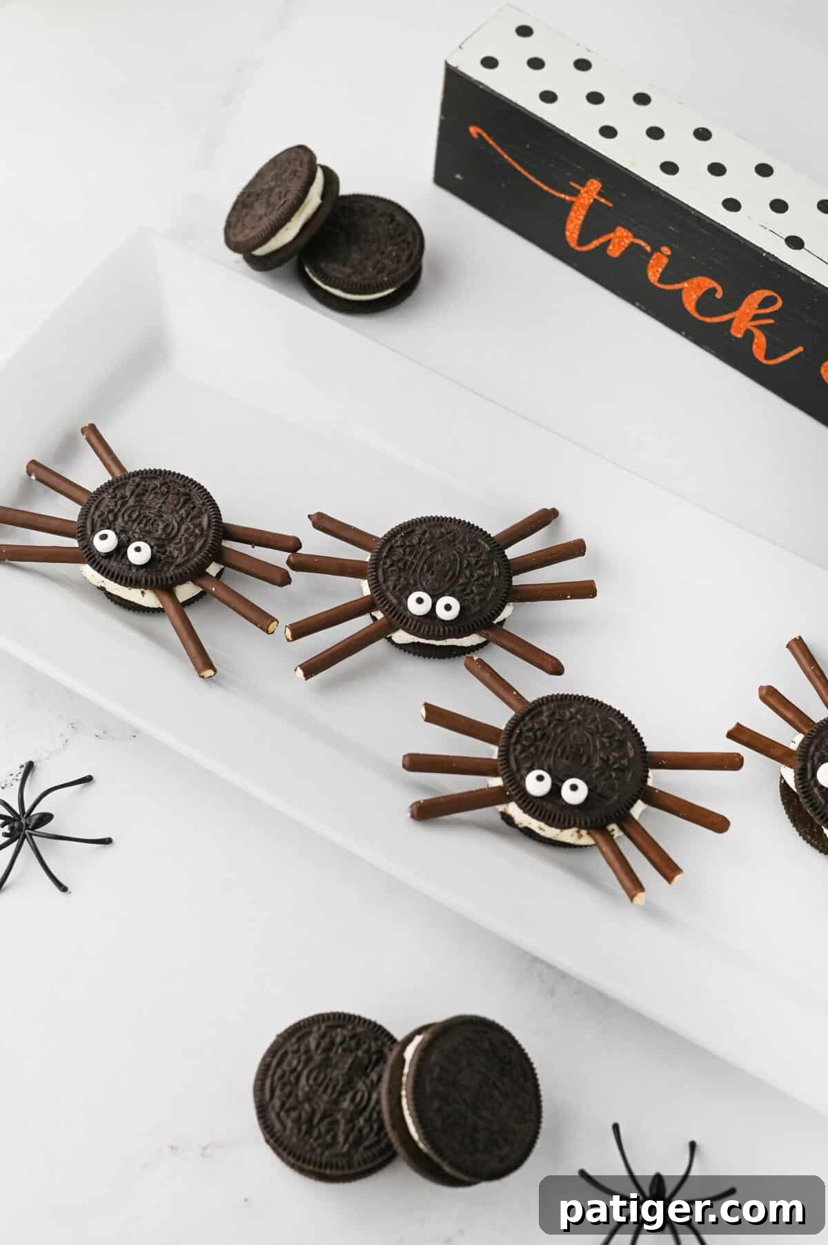 Halloween oreo spiders with pocky legs and candy eyes.