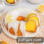 Easy lemon bundt cake made with cake mix and pudding mix and topped with a lemon glaze.