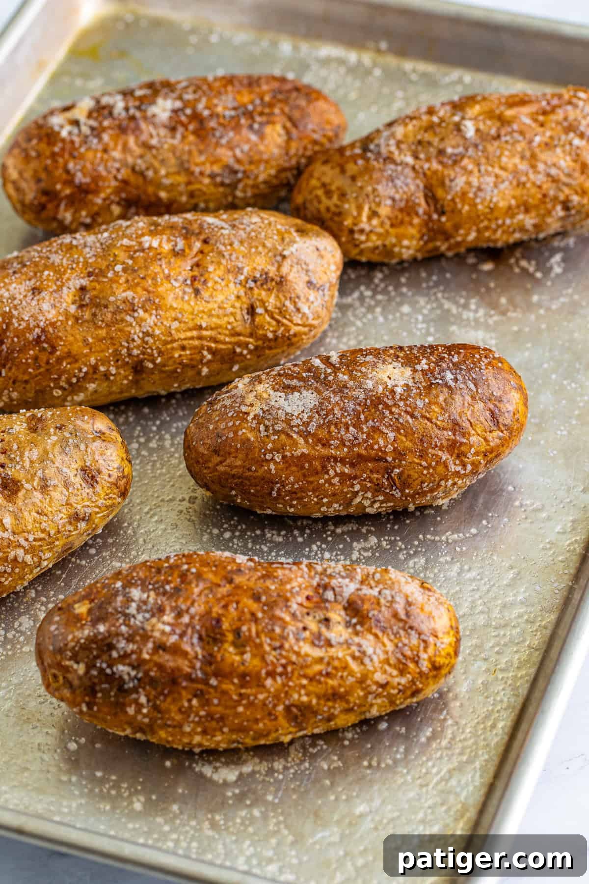 Taco Spud Boats 5 Baked potatoes with crisp salty skin on sheet pan.