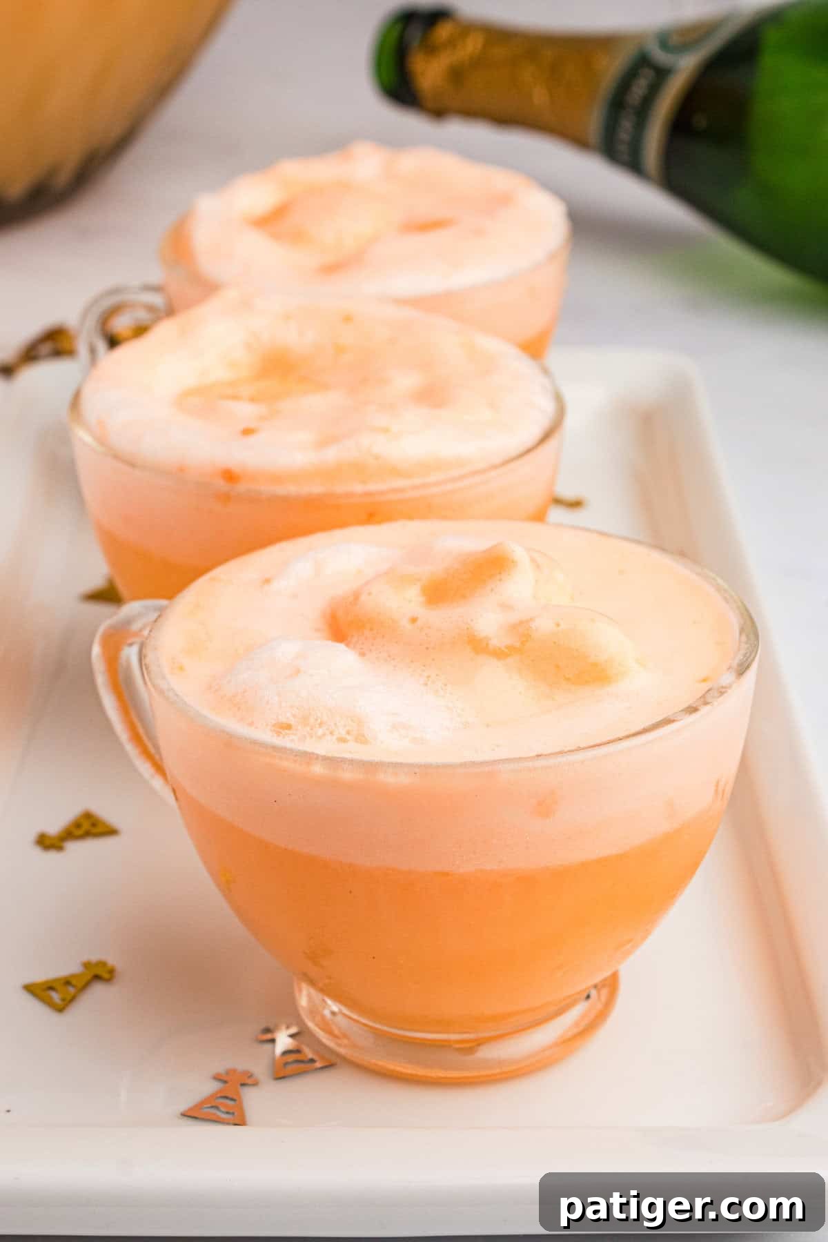 Sparkling Sherbet Punch 8 Orange sherbet champagne punch in old fashioned punch glasses.
