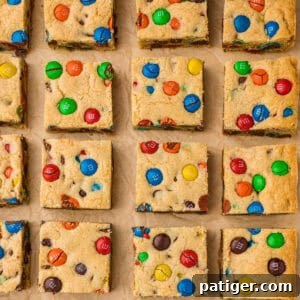 Chocolate chip and M&M cookie bars, showcasing their vibrant colors and tempting texture.