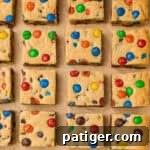 Chocolate chip and M&M cookie bars, close up for texture.