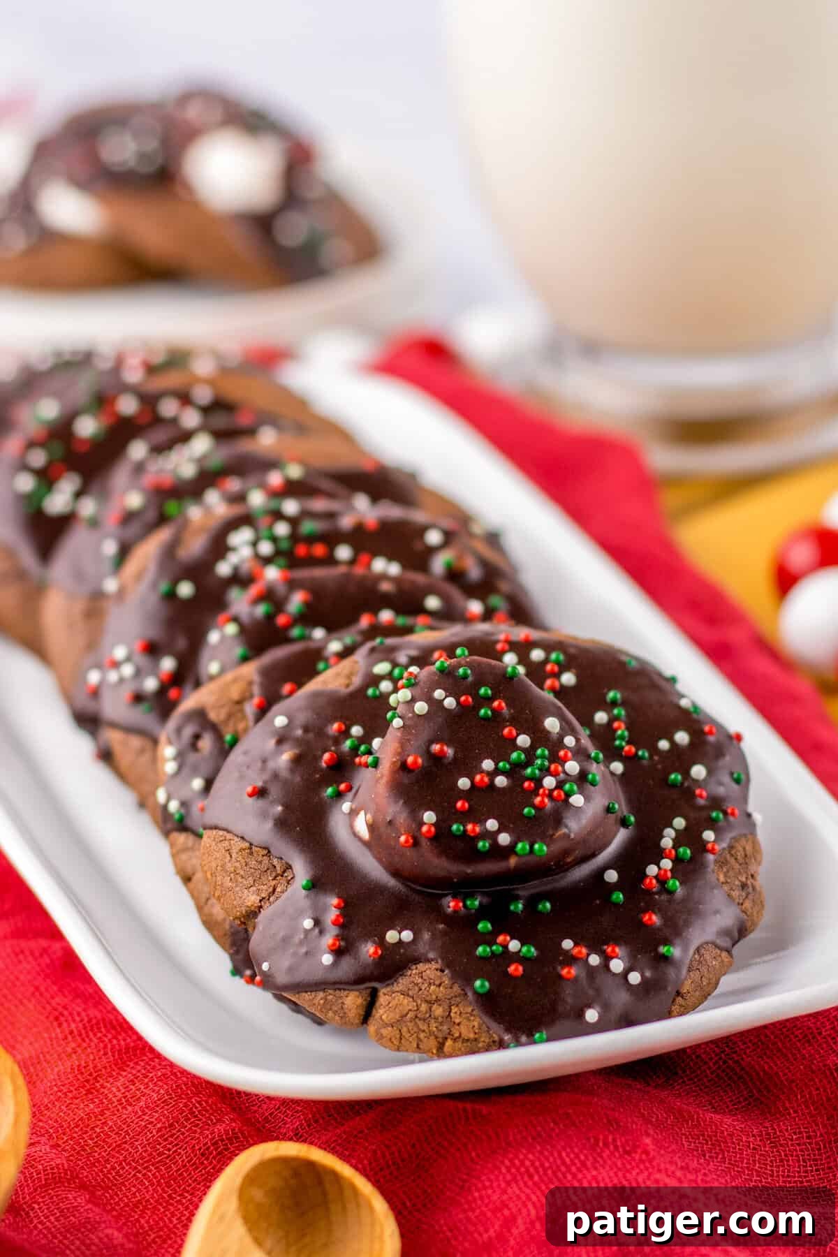Cozy Hot Cocoa Cookies 2 Plate of hot chocolate cookies with marshmallows and chocolate icing, perfect for holiday gatherings.